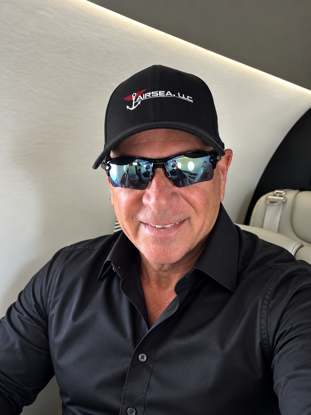 Joe Rizzo, owner of AIRSEA II, seated inside a business jet.